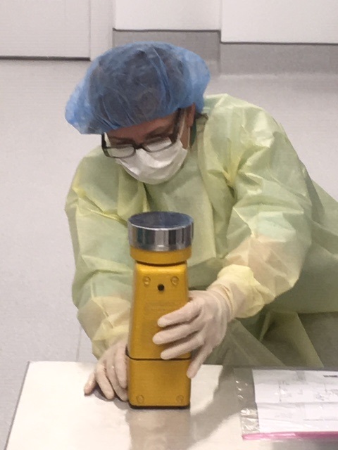 lab worker filling test tubes